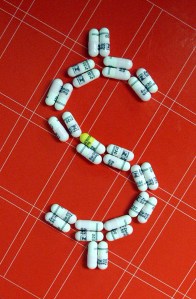 stock exchange pills dollar sign <a href="http://www.tanyajharding.com" target="_blank">Photo by Tanya J. Harding</a> via <a href="http://www.sxc" target="_blank">stock.xchng</a>