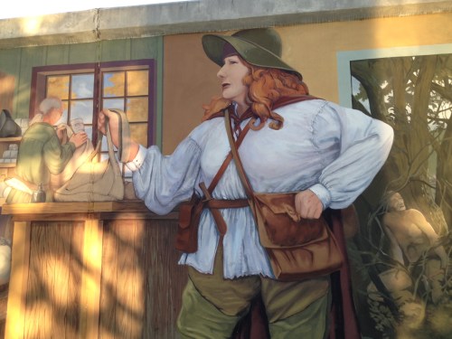 Anne Bailey in one of the dozens of mural panels along the river walk. 
