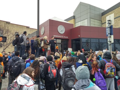 In the morning, South High School students held a sit in for four and half hours (the length of time Michael Brown's body was on the street after he was killed). Then they walked out and marched to the Minneapolis police 3rd precinct. Police cars blocked traffic for the march. 2014-11-25 This photo and text is licensed under a Creative Commons Attribution License by Fibonacci Blue