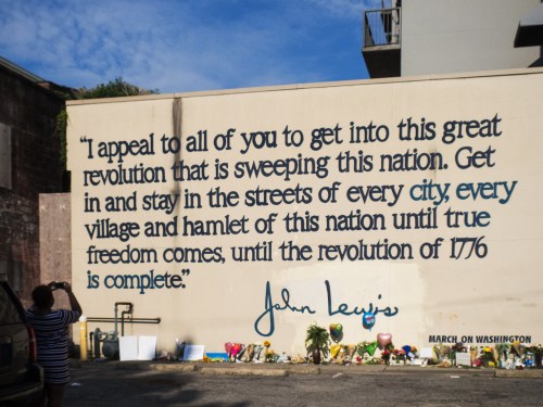 Closeup of mural of Congressman John R. Lewis I appeal to all of you to get into this great revolution that is sweeping this nation. Get in and stay in the streets of every city, every village and hamlet of this nation until true freedom comes, until the revolution of 1776 is complete. John Lewis