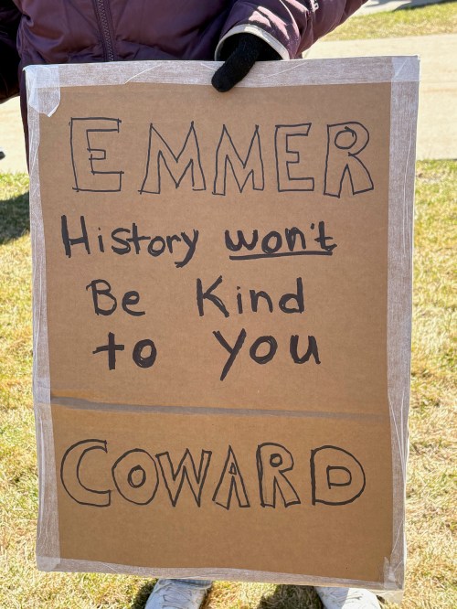 Protest sign: Emmer - History won't be kind to you - coward