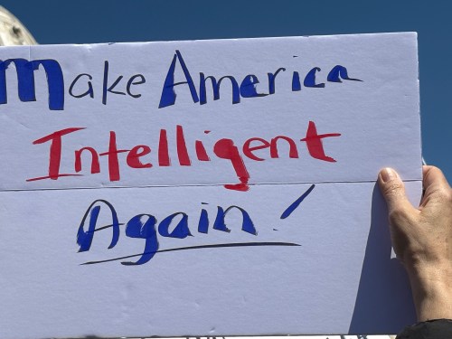 Protest sign: Make America Intelligent Again