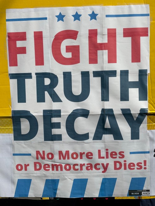 Protest sign: Fight Truth Decay. No more lies or democracy dies